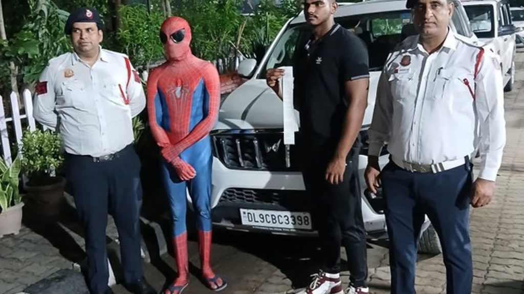 Spiderman on car bonnet video viral and Delhi traffic police booked Case
